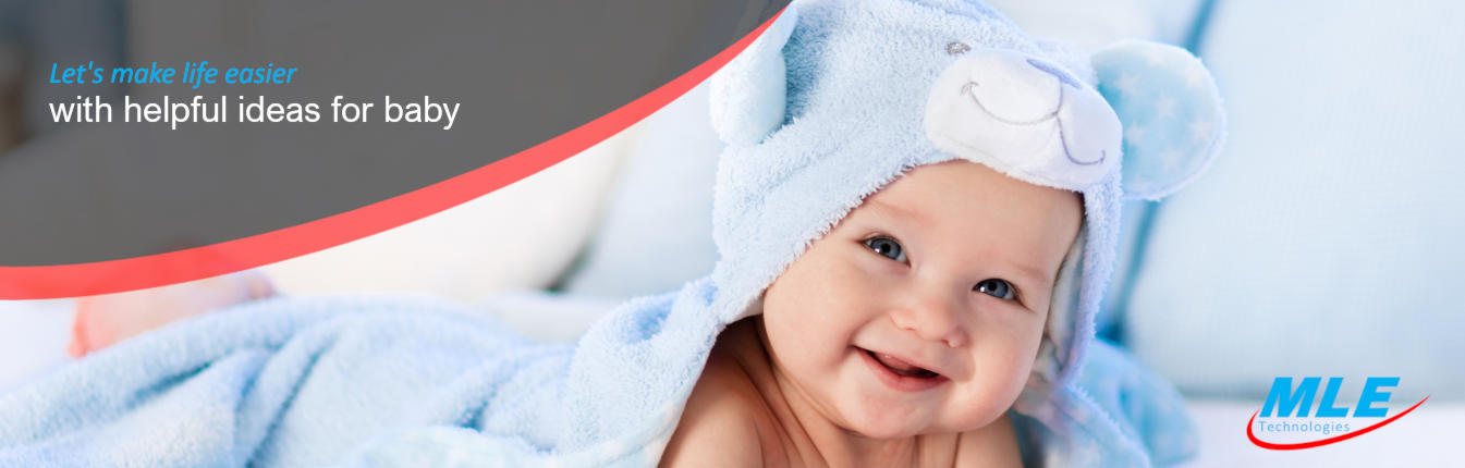 cute baby smiling in a blue gown